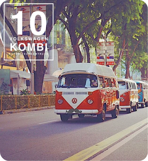Vintage VW Kombi convoy driving down Orchard Road, Singapore