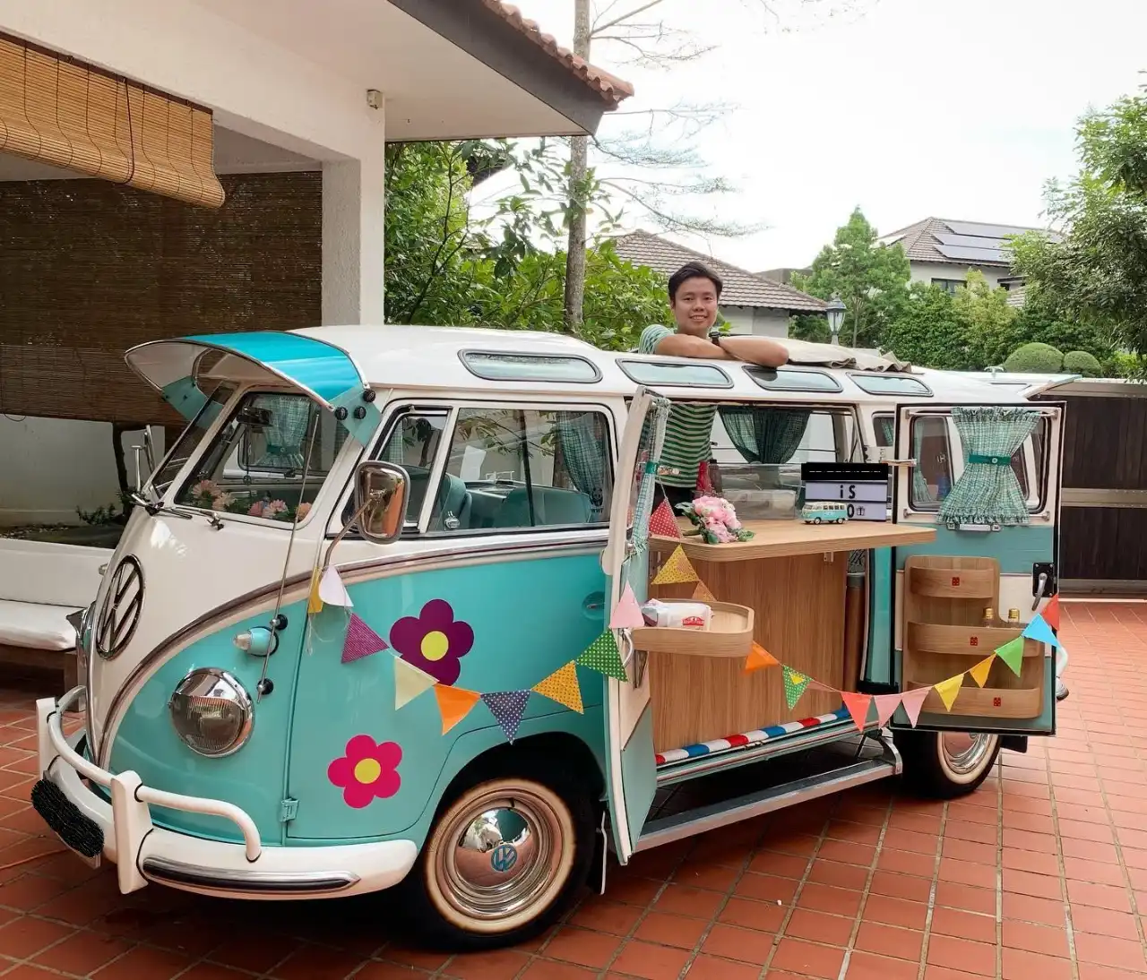 Tiffany-blue vintage VW Kombi styled as a wedding car at a Singapore venue